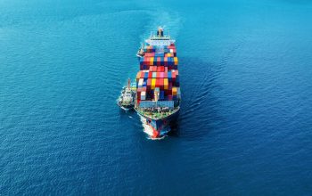 aerial-view-cargo-ship-with-cargo-container-sea_335224-1372