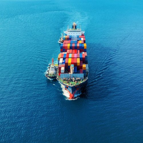 aerial-view-cargo-ship-with-cargo-container-sea_335224-1372